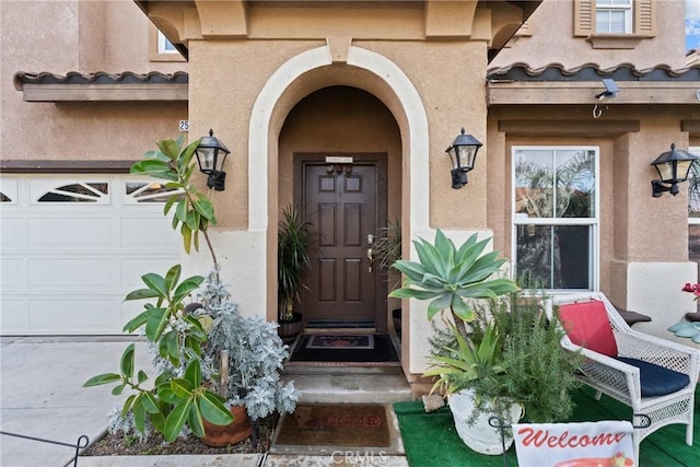 doorway to property featuring a garage