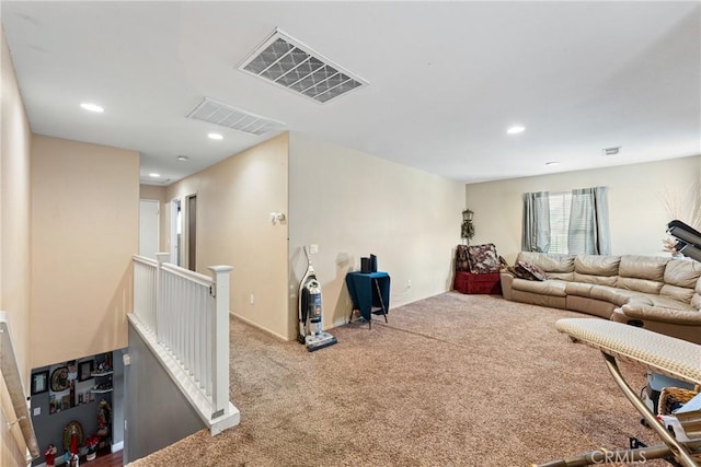 living room with light carpet, visible vents, and recessed lighting