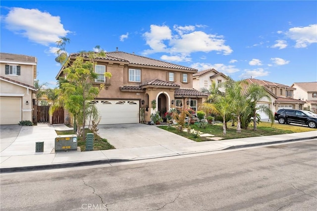 mediterranean / spanish home featuring a garage