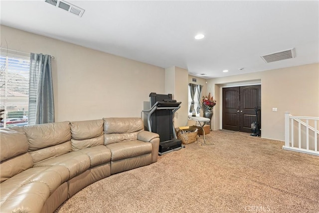 living room with visible vents, carpet flooring, and recessed lighting