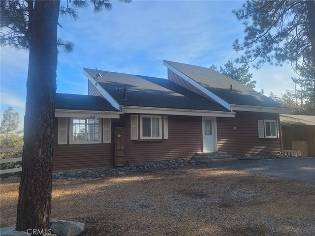 view of front of home featuring a carport