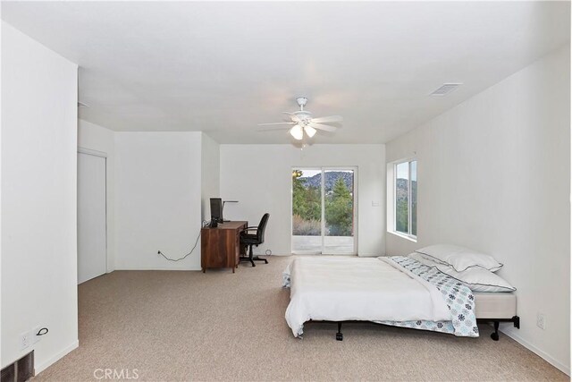 carpeted bedroom with access to exterior and ceiling fan