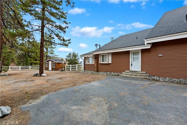 exterior space featuring a storage unit