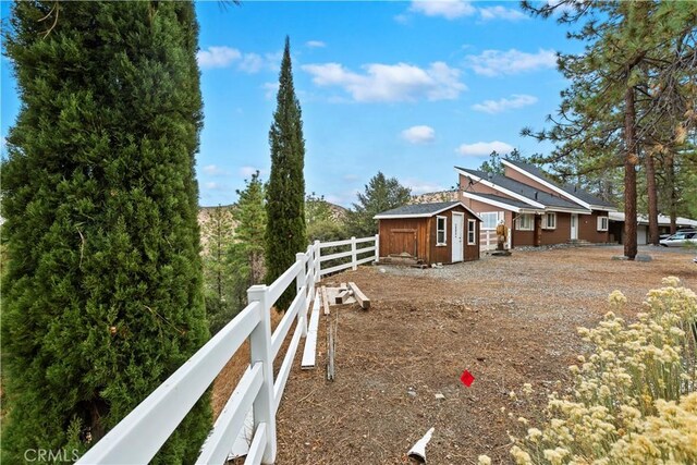 exterior space featuring a shed