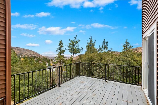 wooden terrace featuring a mountain view