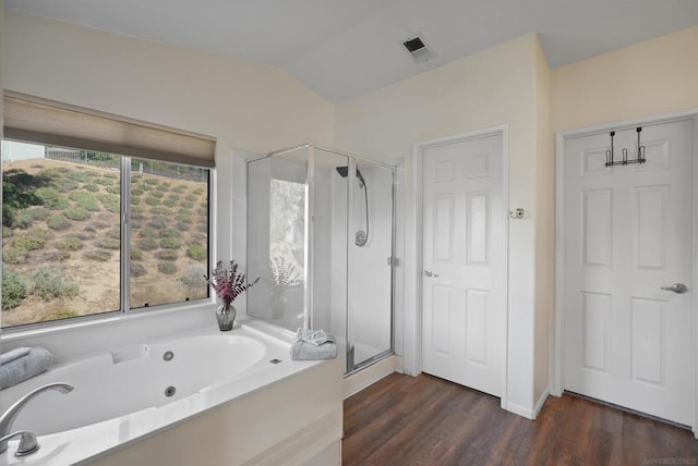 bathroom with hardwood / wood-style floors, lofted ceiling, shower with separate bathtub, and a wealth of natural light