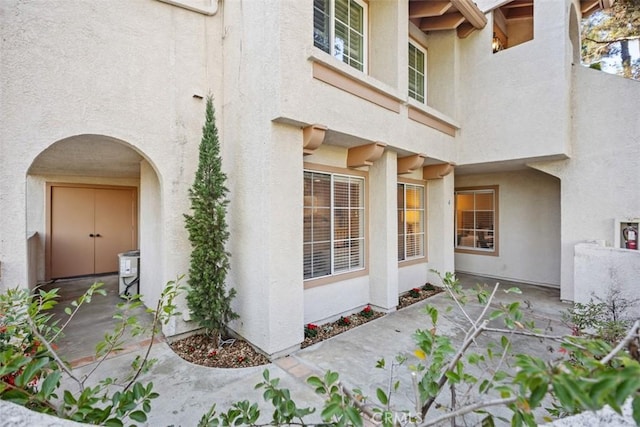 entrance to property with a patio