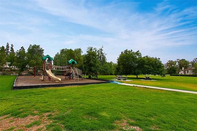 view of jungle gym featuring a lawn