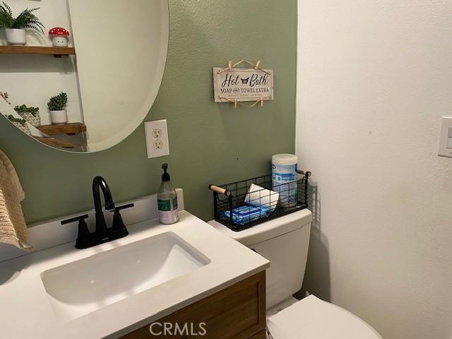 bathroom with vanity and toilet