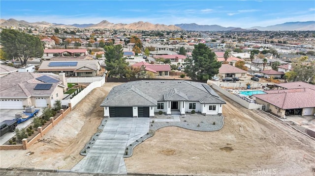 drone / aerial view featuring a mountain view