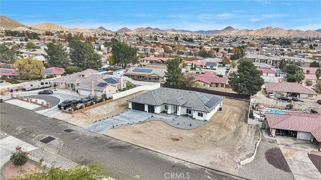 birds eye view of property with a mountain view