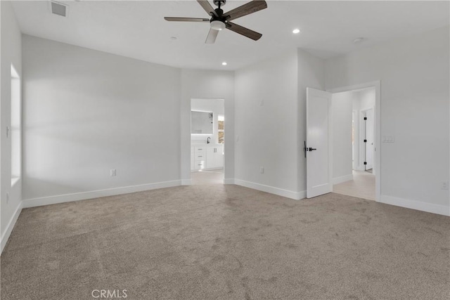 carpeted empty room with ceiling fan