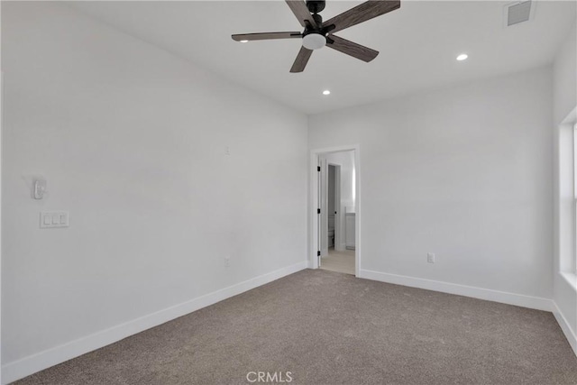 carpeted empty room featuring ceiling fan