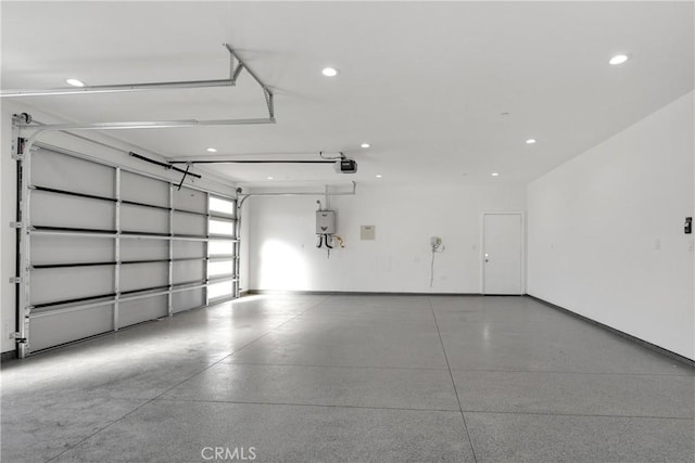 garage featuring a garage door opener and electric panel