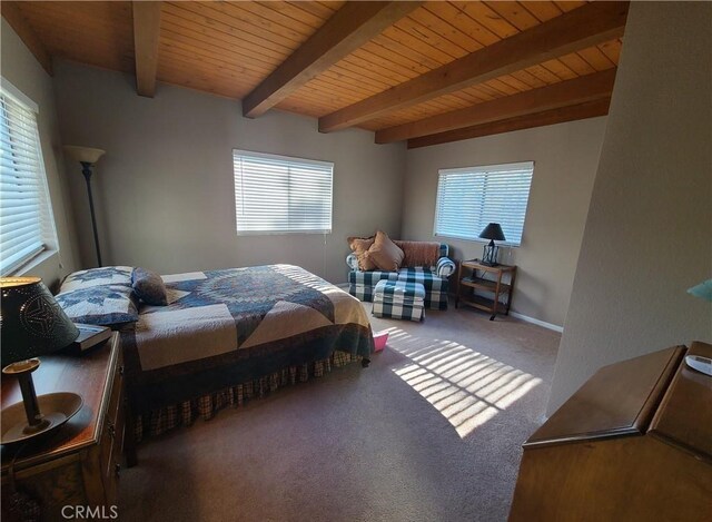 carpeted bedroom with wood ceiling, beam ceiling, and multiple windows