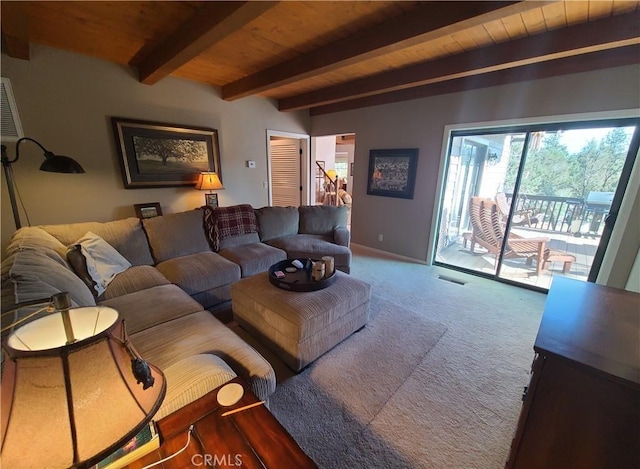 carpeted living room with beamed ceiling and wood ceiling