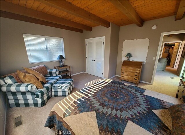 living room featuring wood ceiling, beamed ceiling, and carpet