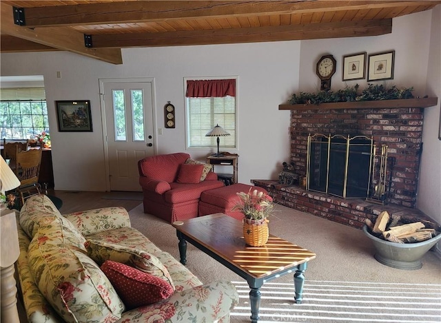 carpeted living room with beamed ceiling, a brick fireplace, and wooden ceiling