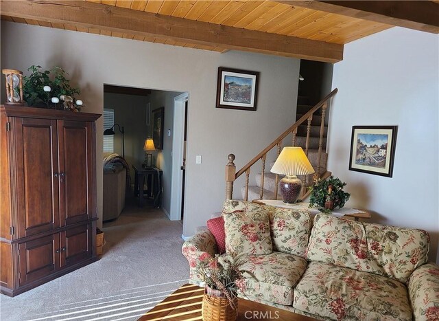 living room featuring wood ceiling, light colored carpet, and beam ceiling