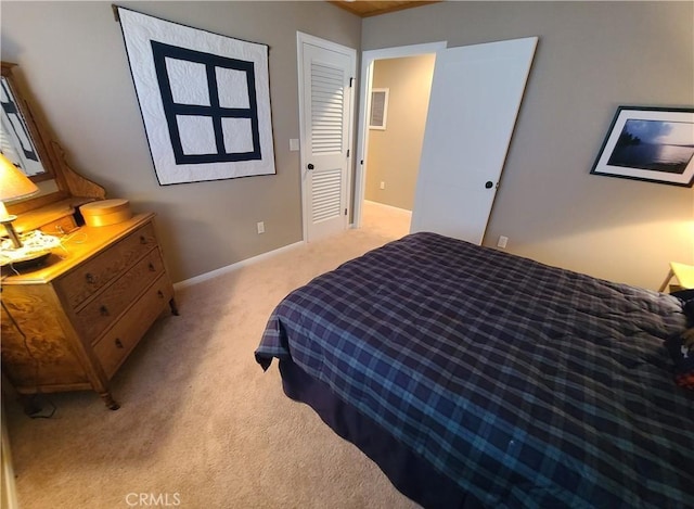 bedroom featuring light carpet