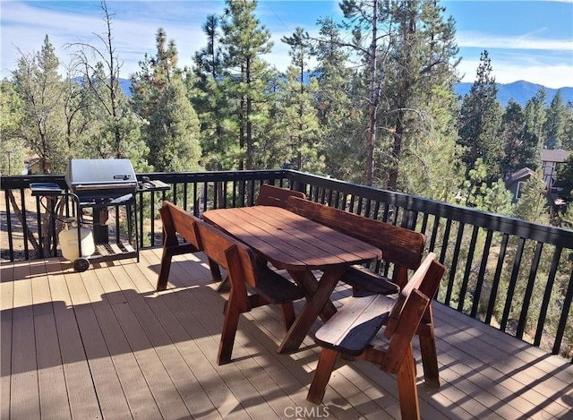 deck featuring area for grilling and a mountain view