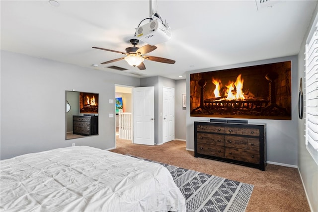 bedroom with light colored carpet and ceiling fan