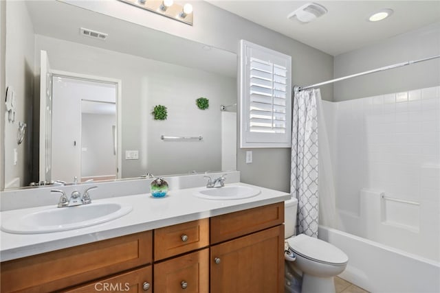 full bathroom with toilet, vanity, and shower / bathtub combination with curtain