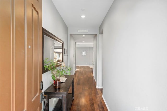 corridor with dark hardwood / wood-style floors