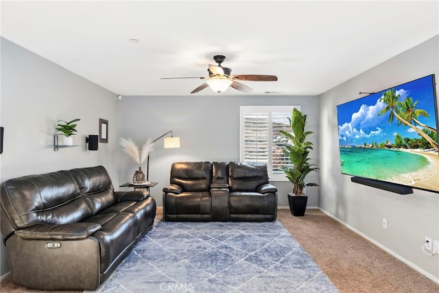 carpeted living room with ceiling fan