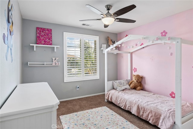 bedroom featuring ceiling fan and dark colored carpet