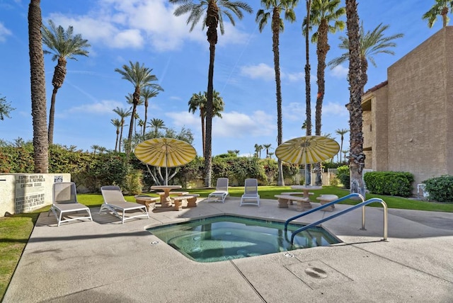 view of swimming pool with a community hot tub and a patio