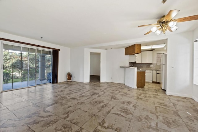 unfurnished living room with ceiling fan