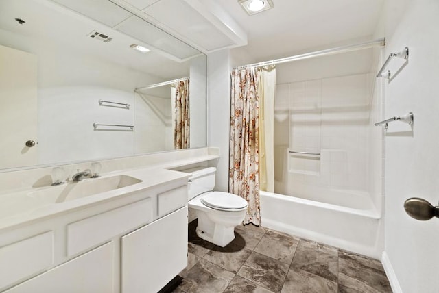 full bathroom featuring shower / bath combo, vanity, and toilet