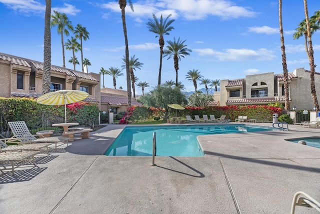 view of swimming pool with a patio area