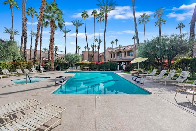 view of swimming pool featuring a patio area