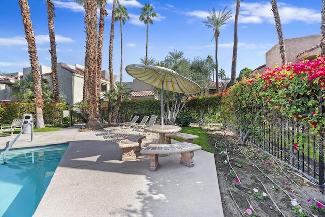 view of patio featuring a swimming pool