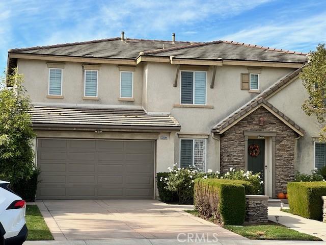 front of property with a garage