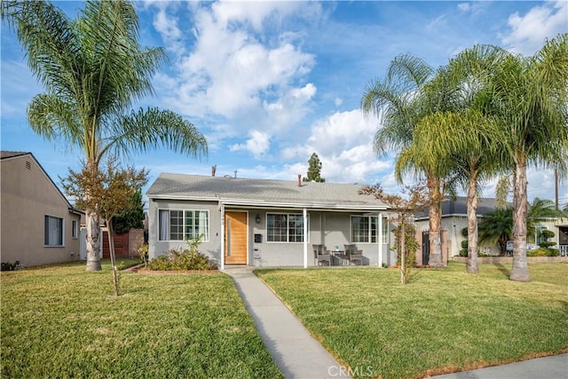 ranch-style home with a front lawn