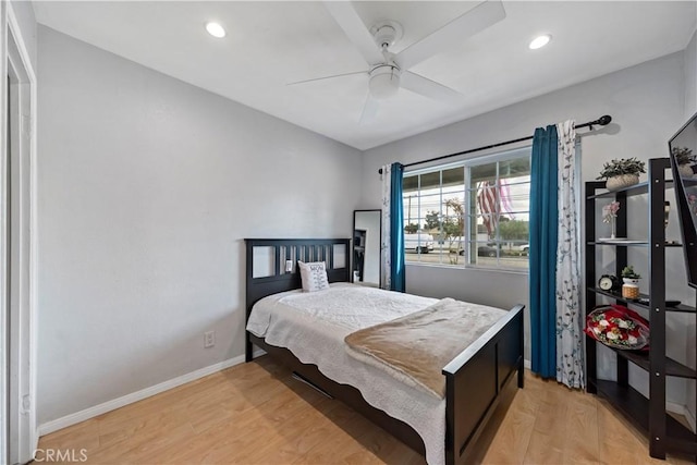 bedroom featuring ceiling fan and light hardwood / wood-style flooring