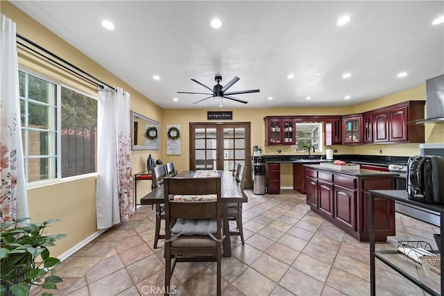 kitchen with french doors, ceiling fan, and sink