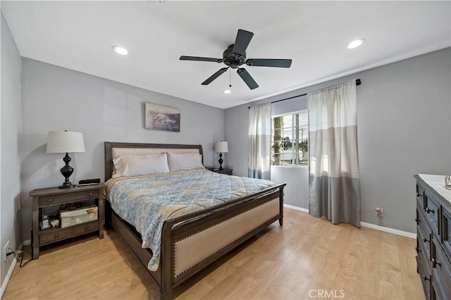 bedroom with ceiling fan and light wood-type flooring