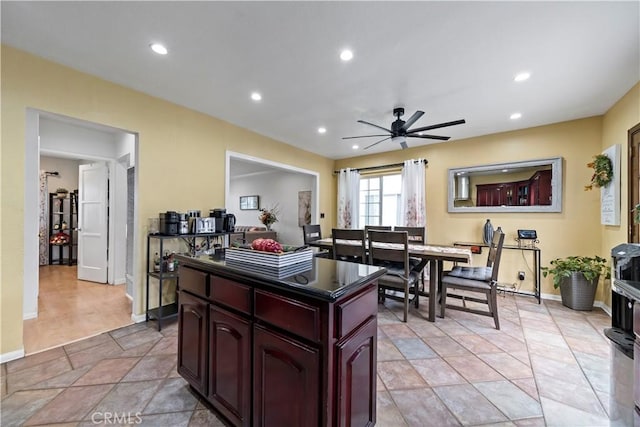 kitchen with a kitchen island and ceiling fan