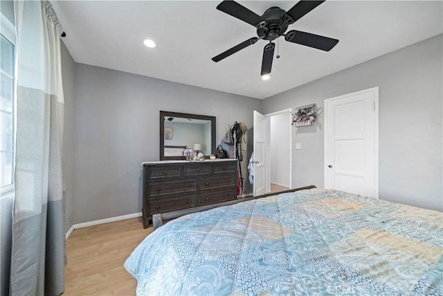 bedroom with light wood-type flooring and ceiling fan