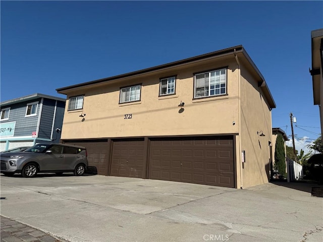 view of side of home featuring a garage