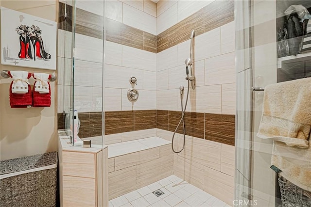 bathroom with a tile shower