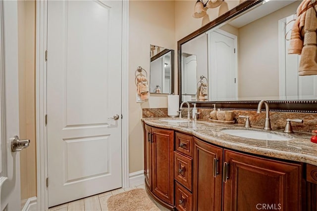 bathroom with tile patterned flooring and vanity