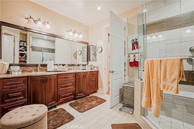 bathroom featuring tile patterned floors, vanity, and walk in shower