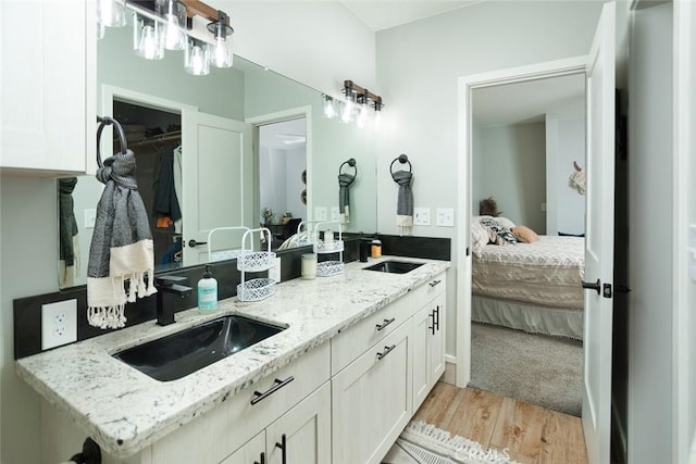 bathroom featuring hardwood / wood-style flooring and vanity