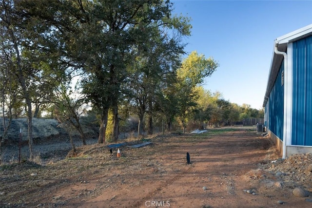 view of yard featuring central AC