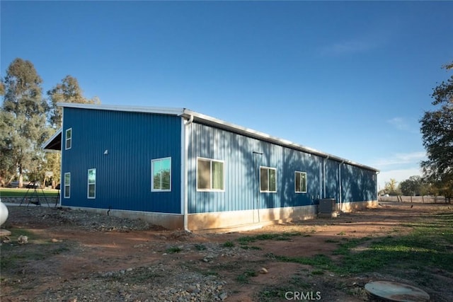 view of home's exterior with central AC